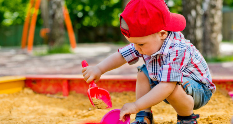 boy, playing, with, toys, in, the, sand, outside