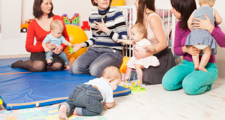 parents, with, their, children, talking, to, daycare, representative