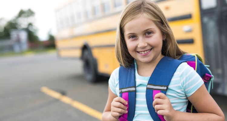 girl, with, backpack, getting, on, the, bus, for, school