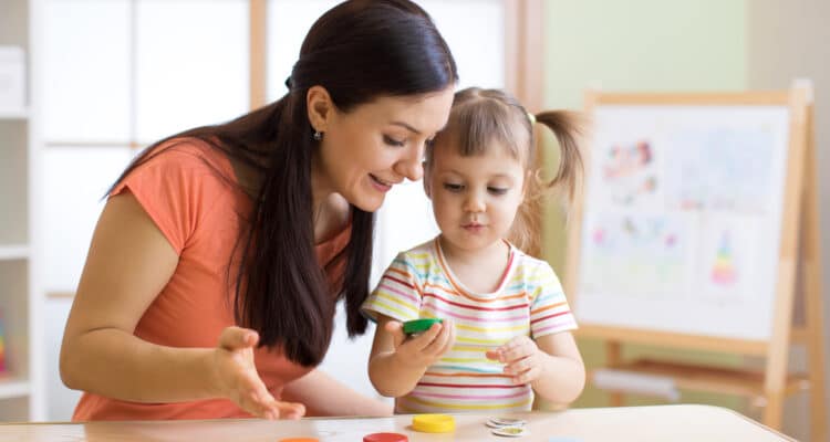 woman, teacher, playing, with, child